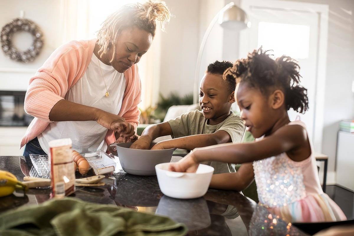 Mom baking with her kids in the kitchen