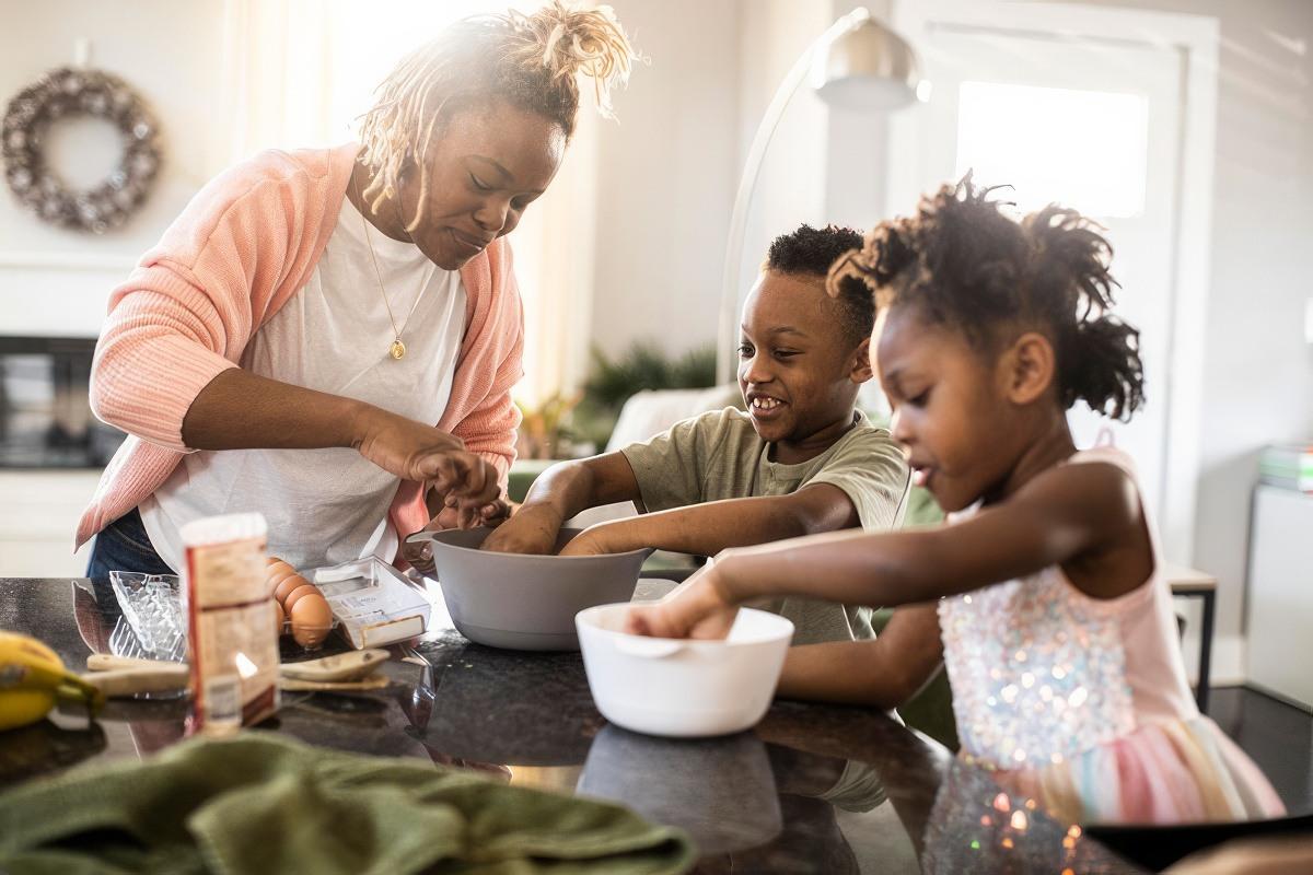 A healthy mom baking with her kids